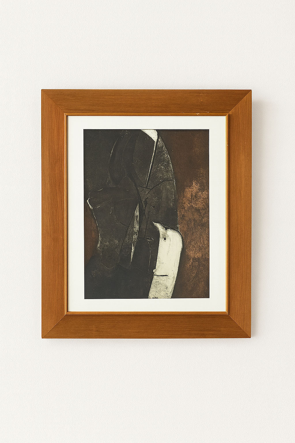 Mid century abstract monotype with dark layered forms, earthy brown and off-white highlights, in vintage wooden frame with off-white mount.