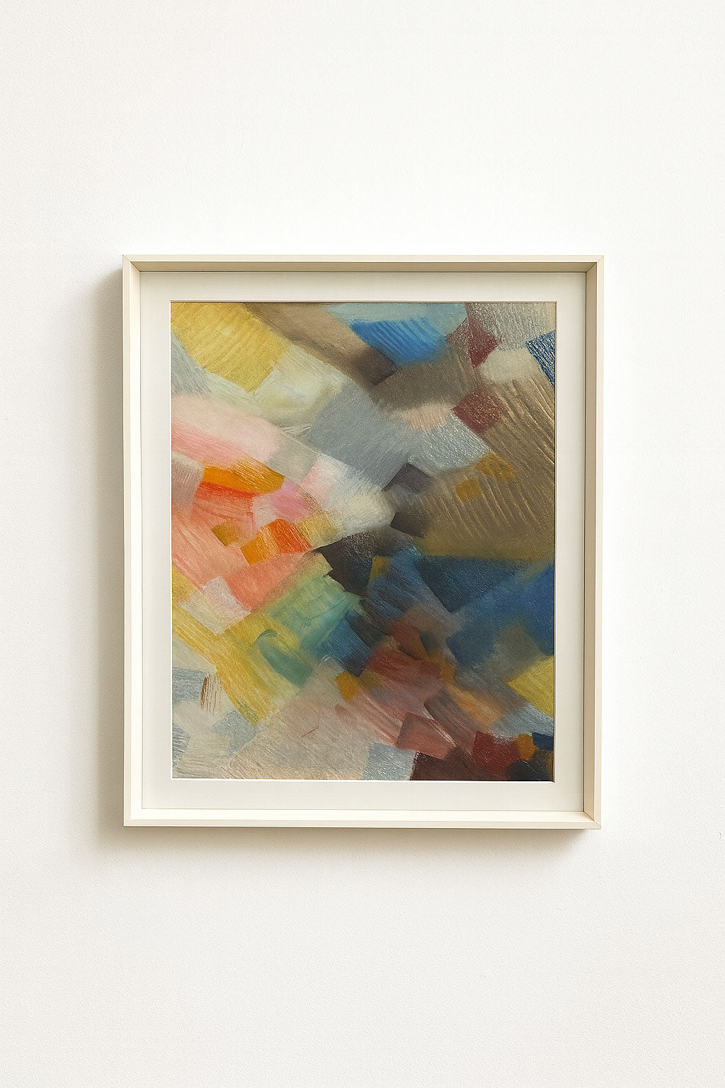 Mid-century pastel abstract on paper with layered warm tones, pinks, blues, and gold. Framed in vintage white wood for a timeless modern look.