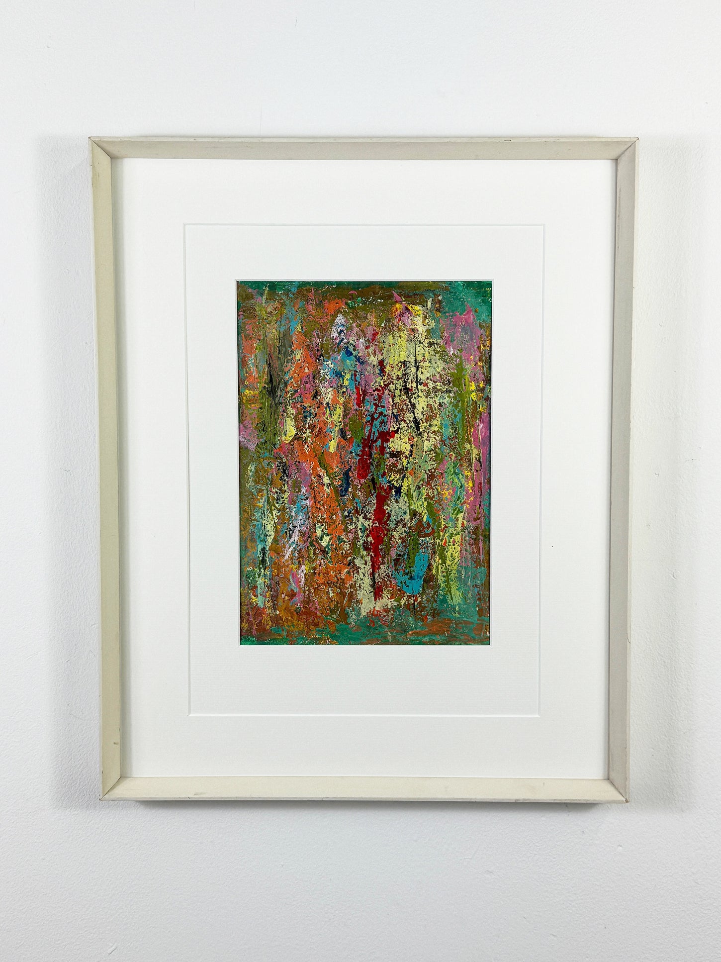 Colorful abstract painting with textured acrylic layers in orange, green, turquoise, and gold, framed in white wood.