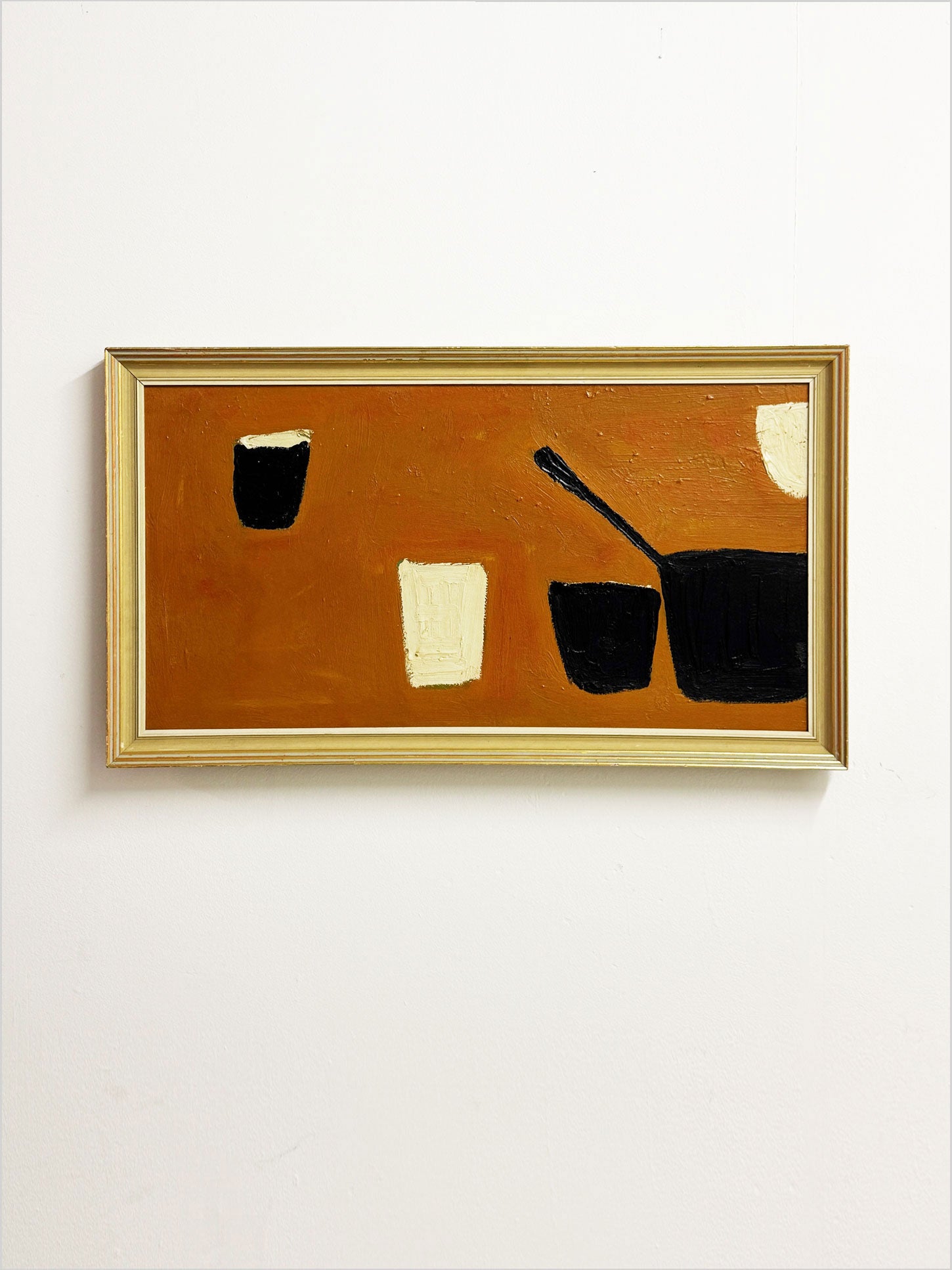 Modernist still life in the style of William Scott with black and cream vessels on an ochre-orange background.